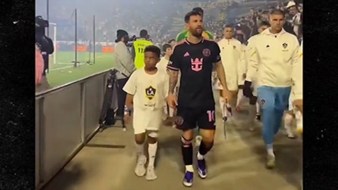 Lionel Messi Walks Kim Kardashian's Son, Saint, Out On Field Ahead Of Game